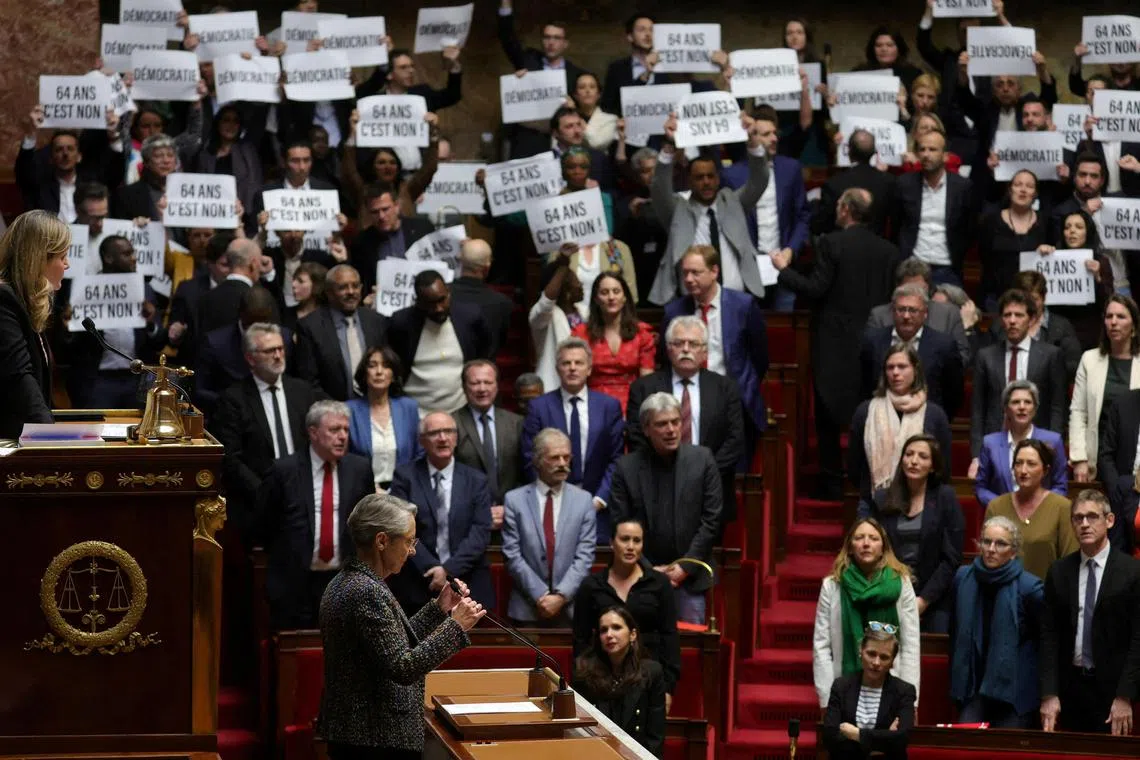 Left-wing lawmakers of the French Parliament sang the national anthem and some held placards reading “No to 64 years”. 