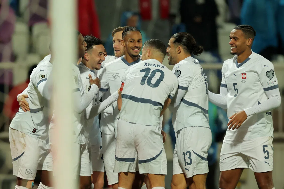 Soccer Football - FIFA World Cup - UEFA Qualifiers - Group B - Kosovo v Switzerland - Fadil Vokrri Stadium, Pristina, Kosovo - November 18, 2025 Switzerland's Ruben Vargas celebrates scoring their first goal with teammates REUTERS/Valdrin Xhemaj