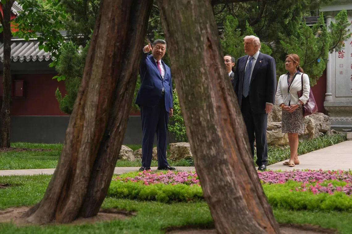 US President Donald Trump (second from right) talking to China’s President Xi Jinping (left) at the Zhongnanhai leadership compound in Beijing on May 15.