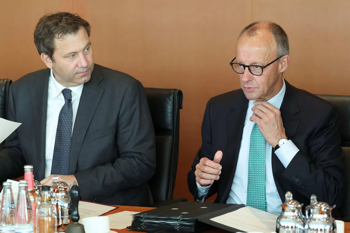 German Chancellor Friedrich Merz and Finance Minister Lars Klingbeil wait for the start of a cabinet meeting at the Chancellery in Berlin, Germany, October 14, 2026. REUTERS/Leonhard Foeger