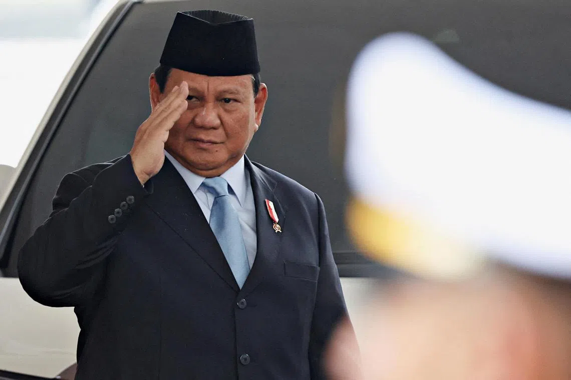 FILE PHOTO: Indonesian President-elect Prabowo Subianto gestures as he attends the annual State of the Nation Address at the parliament building, ahead of the country's Independence Day, in Jakarta, Indonesia, August 16, 2024. REUTERS/Ajeng Dinar Ulfiana/Pool/File Photo