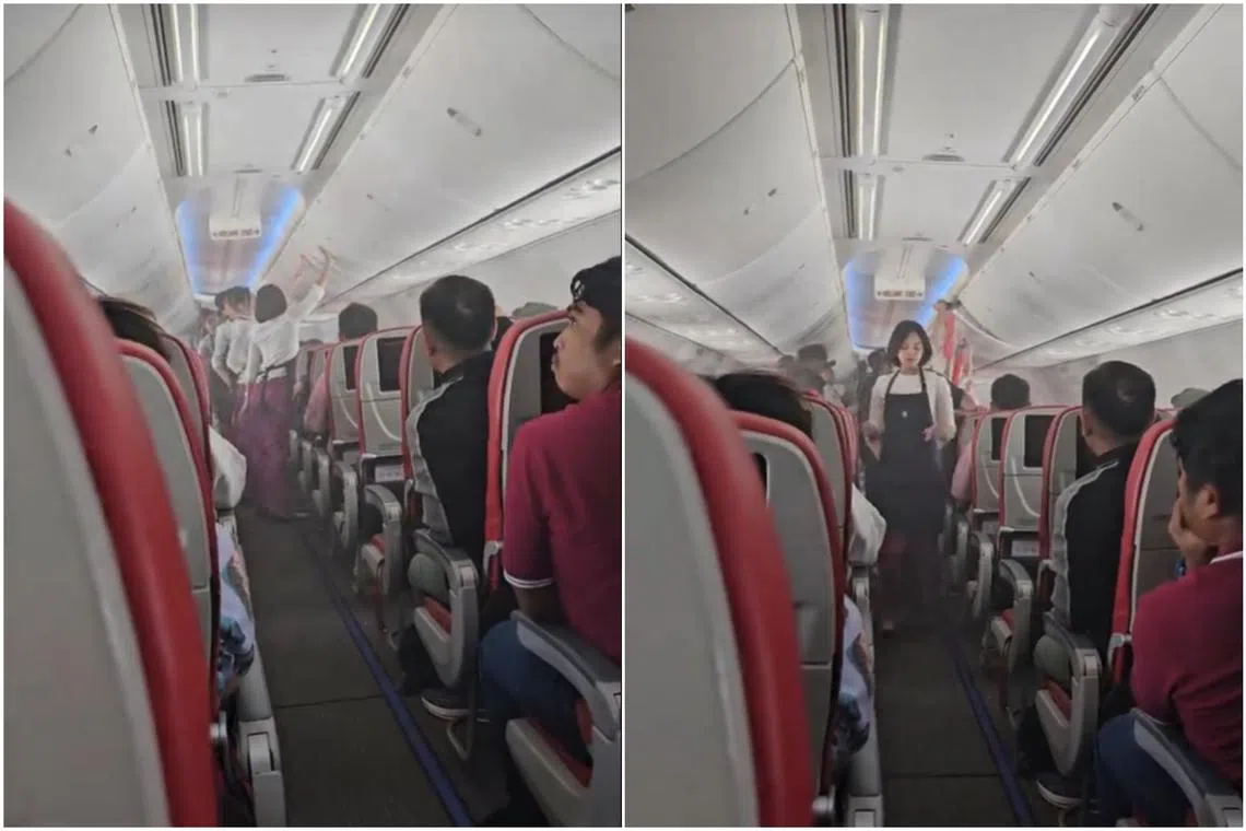Flight attendants asked some passengers seated directly below the smoky compartment to leave their seats while they used a fire extinguisher to put out the fire.