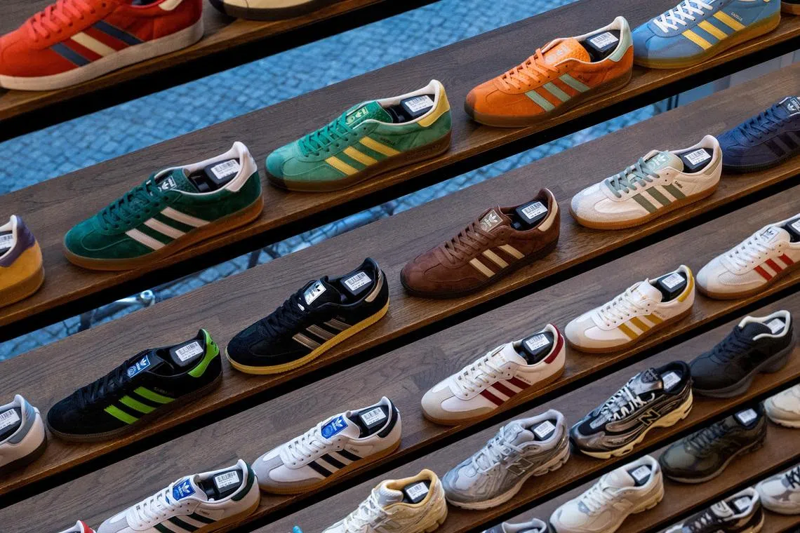 Adidas sneakers and other shoes for sale are pictured at a shop in Berlin, Germany, May 2, 2024. REUTERS/Lisi Niesner