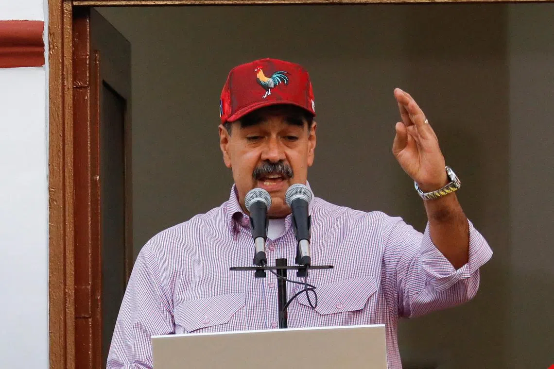 FILE PHOTO: Venezuelan President Nicolas Maduro addresses supporters during a march marking the first anniversary of his victory in the disputed July 28 presidential election, in Caracas, Venezuela July 28, 2025. REUTERS/Leonardo Fernandez Viloria/File Photo