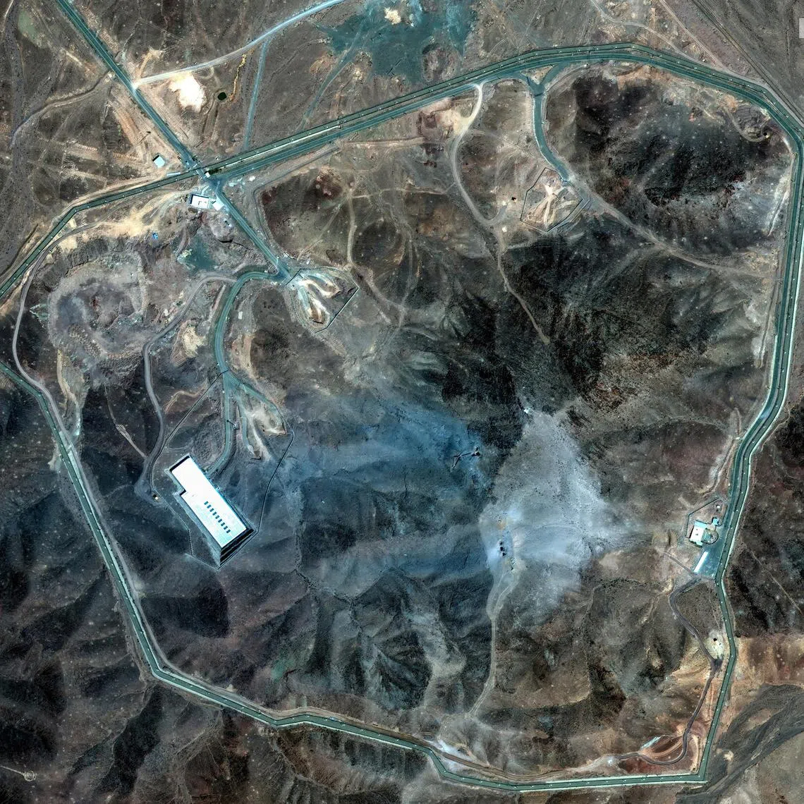 FILE PHOTO: A satellite view shows an overview of Fordow underground complex, after the U.S. struck the underground nuclear facility, near Qom, Iran June 22, 2025.     MAXAR TECHNOLOGIES/Handout via REUTERS    THIS IMAGE HAS BEEN SUPPLIED BY A THIRD PARTY. NO RESALES. NO ARCHIVES. MANDATORY CREDIT. DO NOT OBSCURE LOGO./File Photo