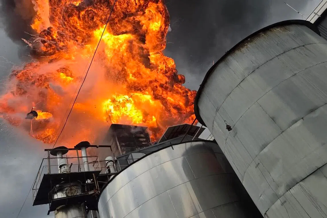 Flame and smoke fumes out from a factory producing raw materials for paint in South Korea’s South Chungcheong province, on Aug. 28.