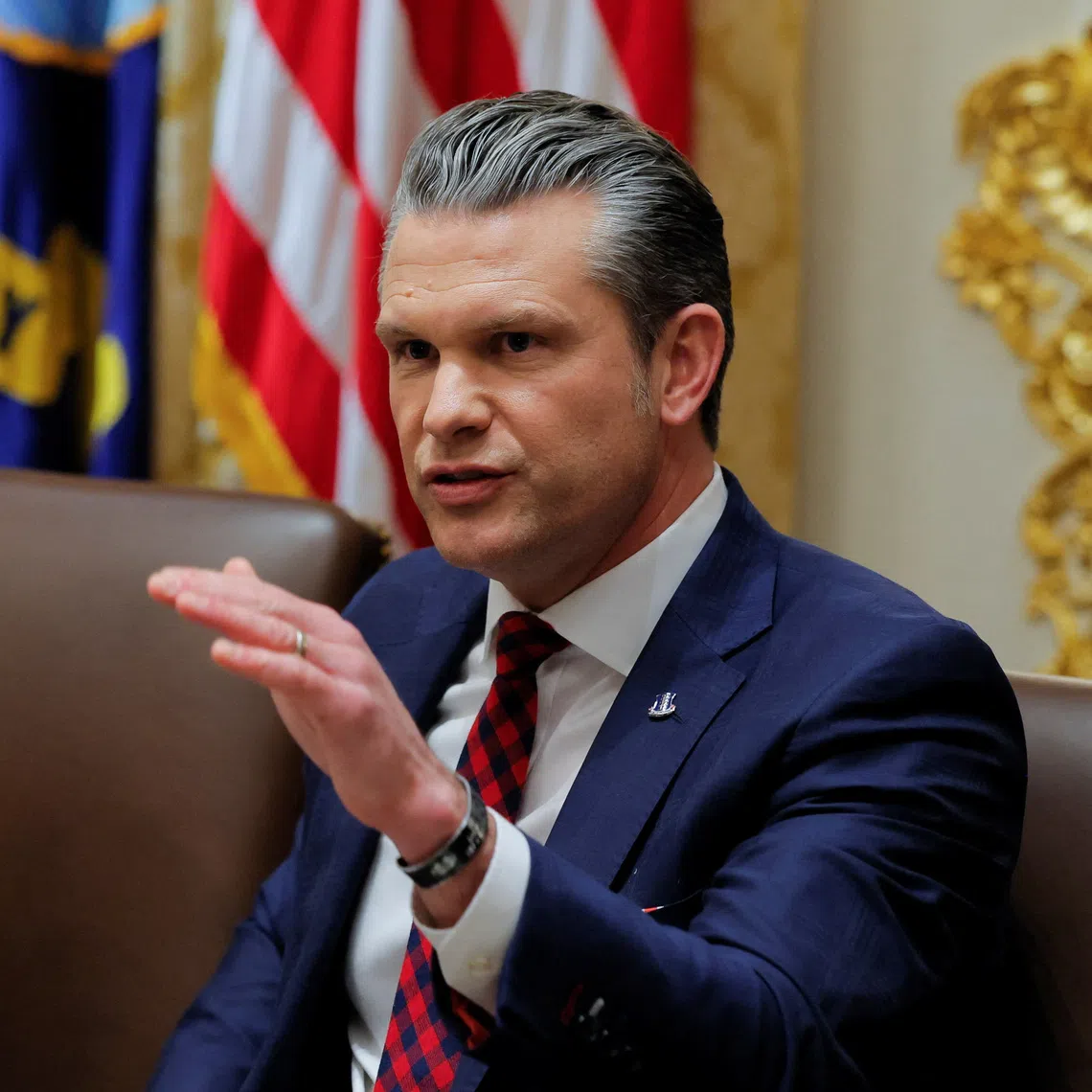 US Secretary of Defense Pete Hegseth (right) at a cabinet meeting with US President Donald Trump on Dec 2.