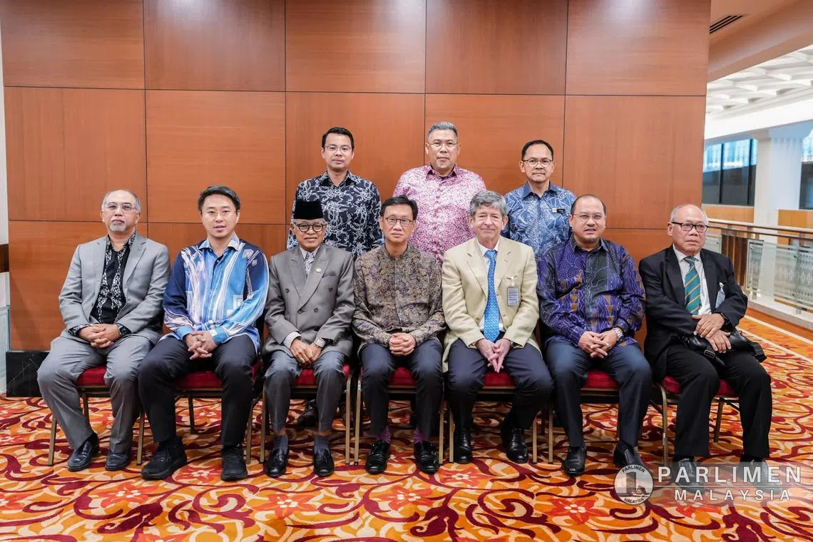 Members of the Select Committee on International Relations and International Trade posed for a photo with Lynas interim CEO Pol Le Roux (sitting, third from right) in the Malaysian Parliament on July 16.