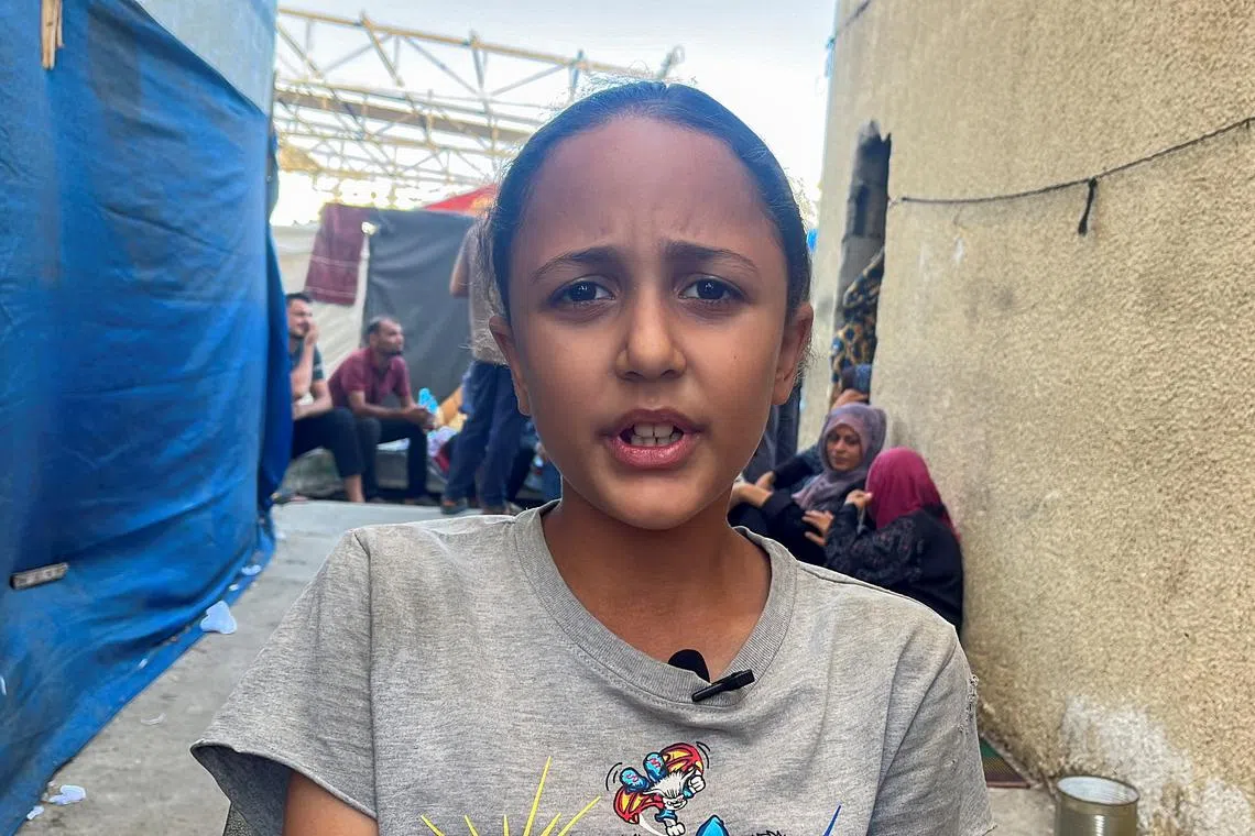 A displaced Palestinian student, Rama Abu Seif, speaks during an interview with Reuters, at a school where she shelters with her family, as war disrupts a new academic year, in Deir Al-Balah in the central Gaza Strip, September 2, 2024. REUTERS/Hussam Al-Masri