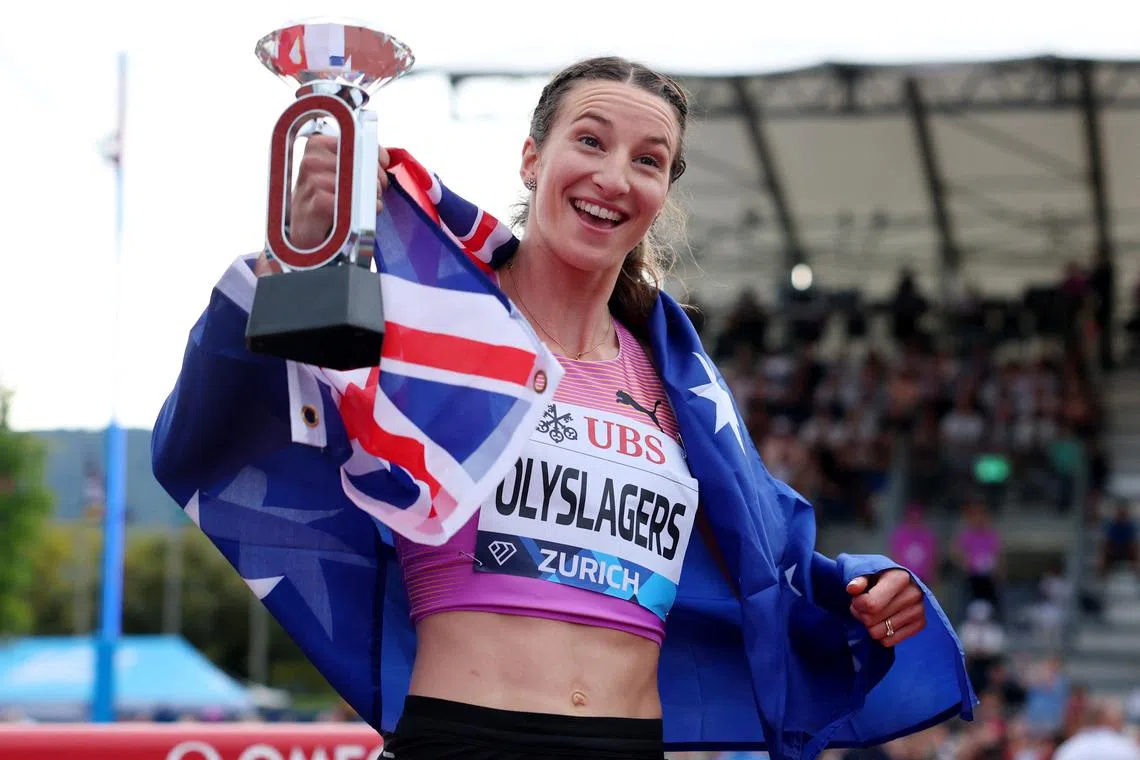 FILE PHOTO: Athletics - Diamond League - Final - Zurich - Zurich, Switzerland - August 27, 2025 Australia's Nicola Olyslagers celebrates with the trophy after winning the women's high jump final REUTERS/Denis Balibouse/File Photo