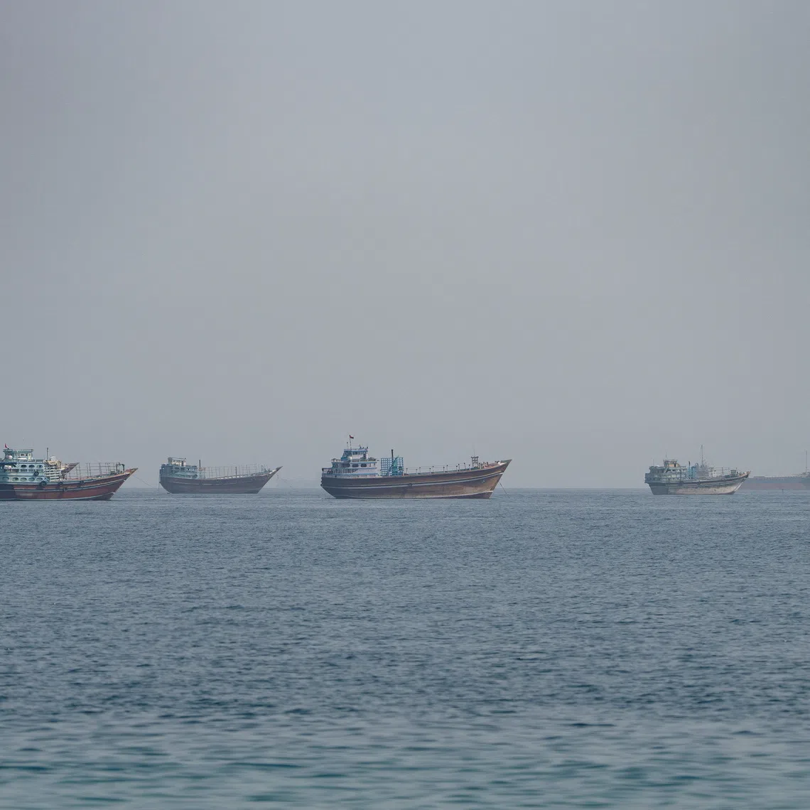 Vessels near the Strait of Hormuz, as seen from Musandam, Oman, August 24, 2026. REUTERS/Stringer