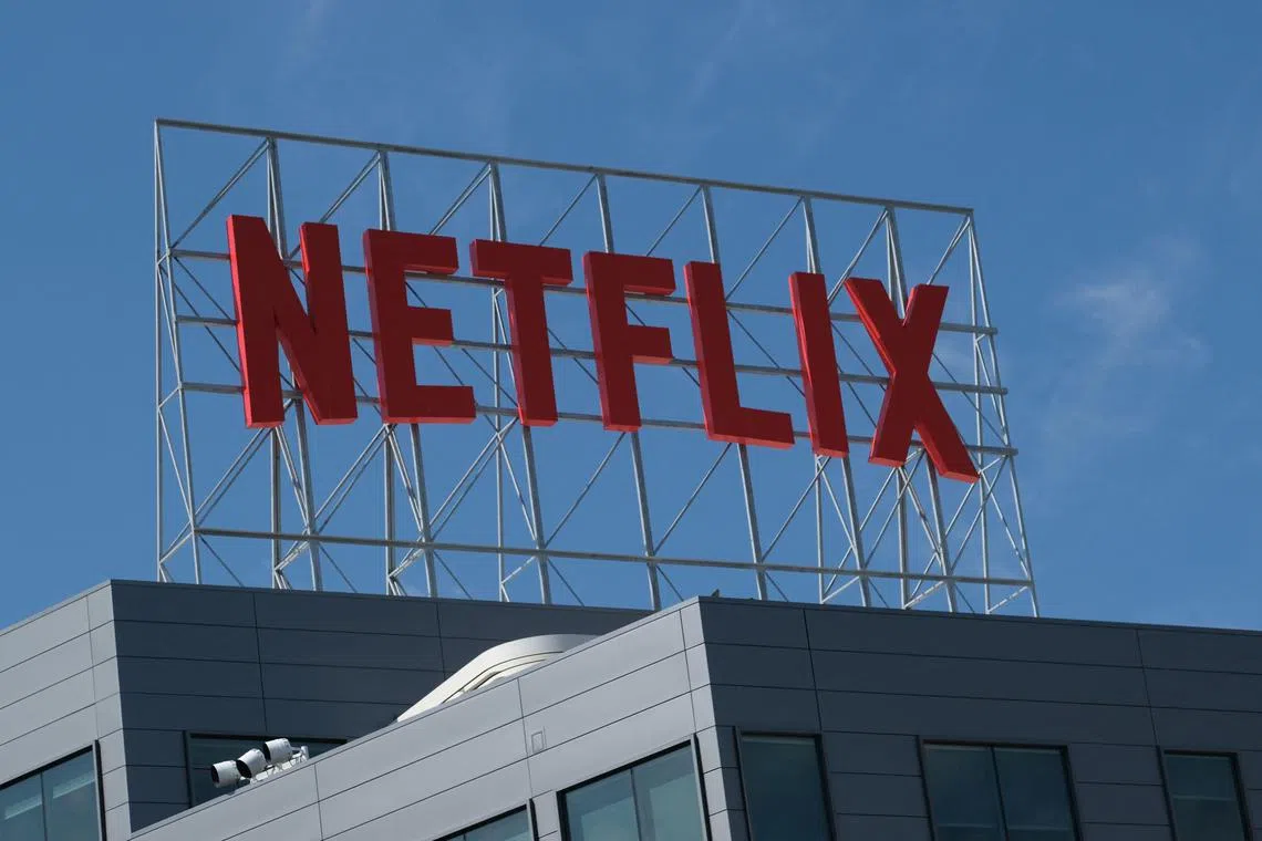(FILES) The Netflix logo is seen on top of their office building in Hollywood, California, March 2, 2022. - April 19, 2023, after shipping out more than five billion DVDs in trademark red envelopes, Netflix has finally called time on the movie mail-out subscription business that launched today's Hollywood streaming colossus.
The announcement, made in a letter to shareholders before this week's earnings call, was greeted with bafflement by some broadband binge-watchers who did not know Netflix's DVD business was still running -- or that it existed in the first place. (Photo by Chris DELMAS / AFP)