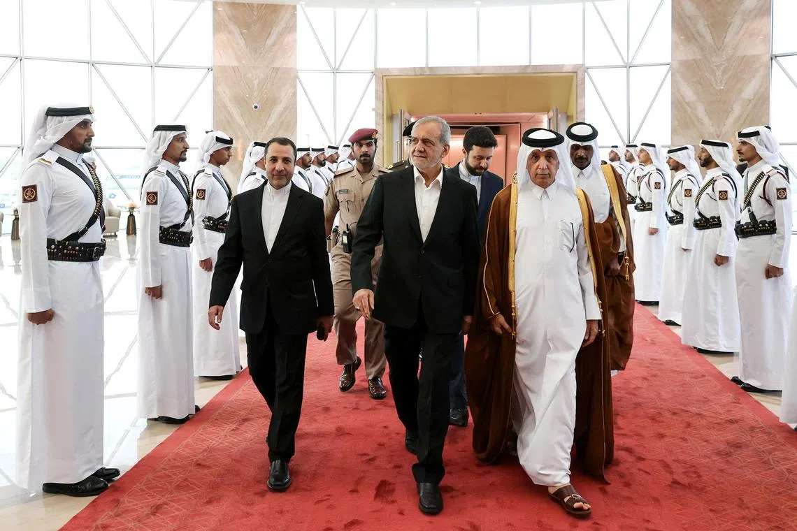Iranian President Masoud Pezeshkian is welcomed by Qatari officials upon his arrival in Doha.