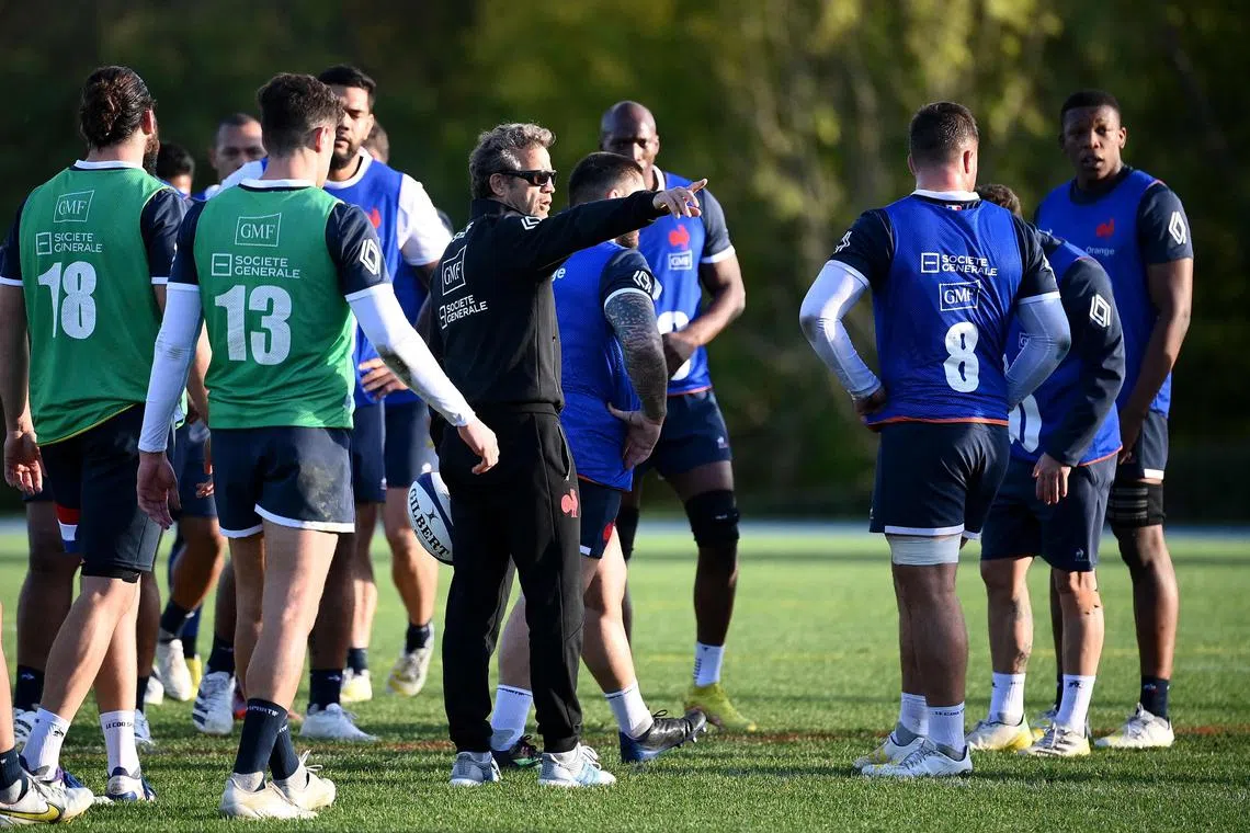 France's head coach Fabien Galthie speaks to his players during a training session in Marcoussis, south of Paris, on Nov 9, 2022.