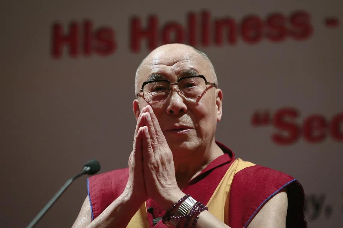 FILE PHOTO: Exiled Tibetan spiritual leader the Dalai Lama gestures during a speech at the 108th anniversary of Indian Merchant Chambers in Mumbai September 18, 2014. REUTERS/Danish Siddiqui/File Photo