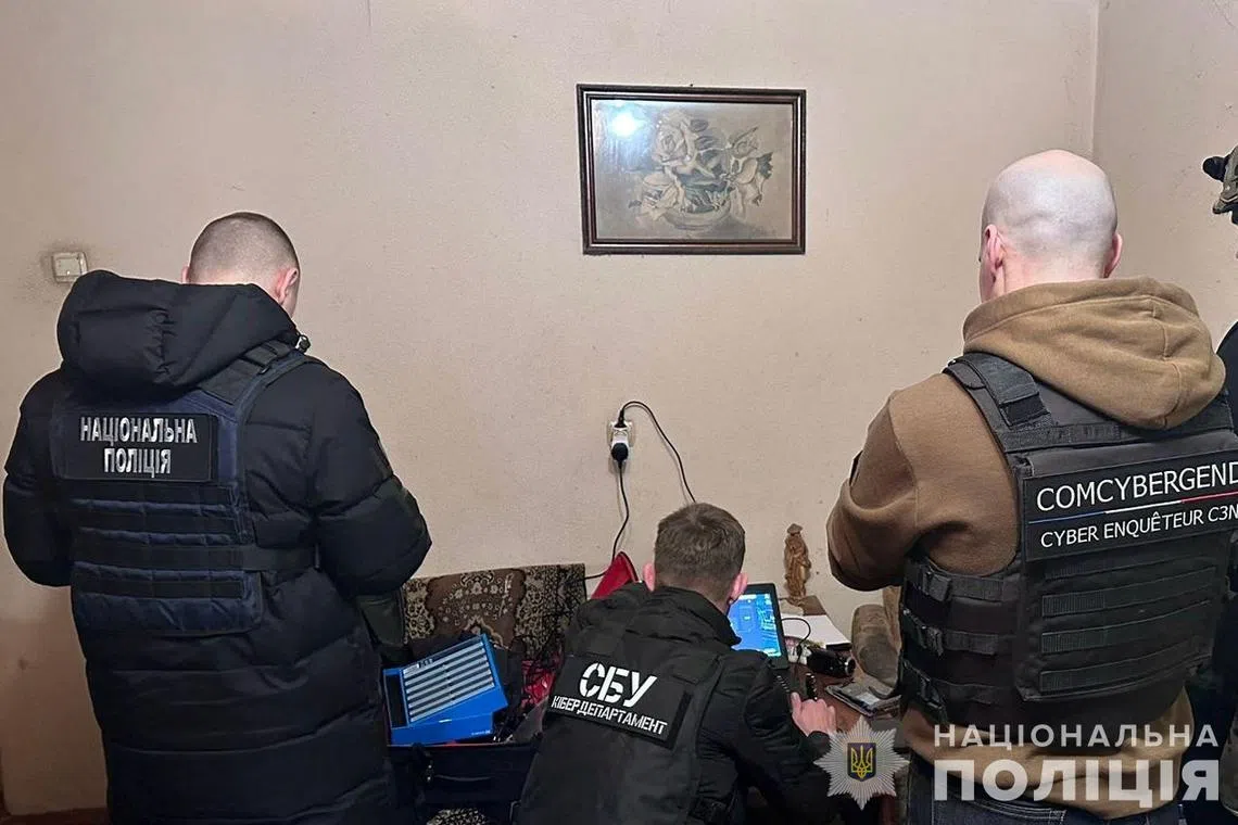 Cybersecurity specialists from Ukraine's Security Service work at an unknown location in Ukraine, in this undated handout released February 21, 2024. State Security Service of Ukraine/Handout via REUTERS