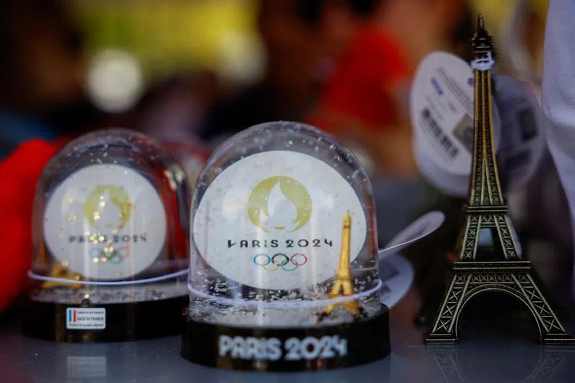 Snowballs of Paris 2024 Olympics and a miniature of the Eiffel Tower are displayed at the official store during the Paralympic Day at Place de la Republique, Paris, France October 8, 2023. REUTERS/Sarah Meyssonnier/File Photo