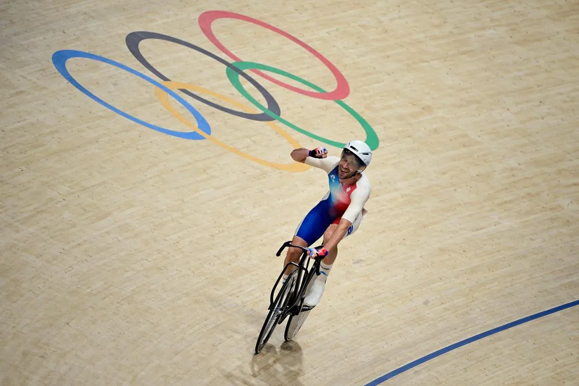 France's Benjamin Thomas celebrates after winning the men's track cycling omnium.