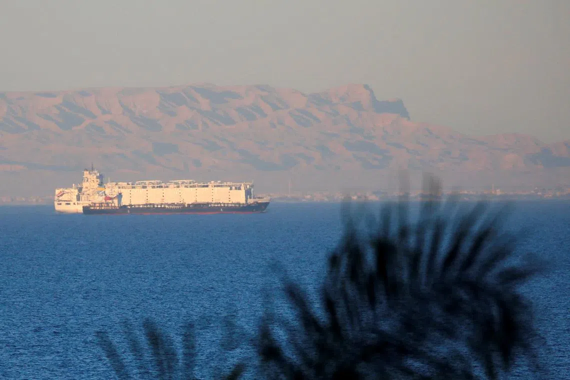FILE PHOTO: Container ships sail across the Gulf of Suez towards the Red Sea before entering the Suez Canal, in El Ain El Sokhna in Suez, east of Cairo, Egypt, March 17, 2018. Picture taken March 17, 2018. REUTERS/Amr Abdallah Dalsh/File Photo