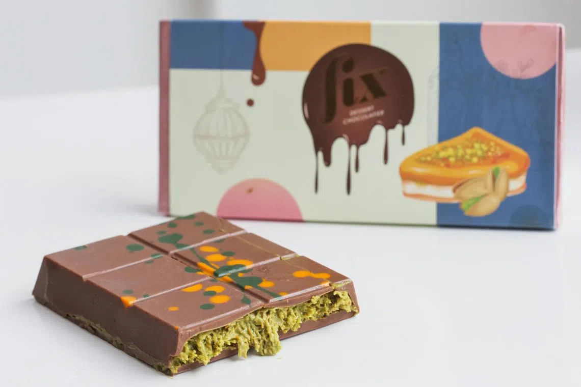 (Can?t Get Knafeh of It-Hero by FIX Dessert Chocolatier)

The unique chocolate bar oozing a bright green pistachio cream filling is only officially available in Dubai.

Photograph at ST studio on Sep 5, 2024.