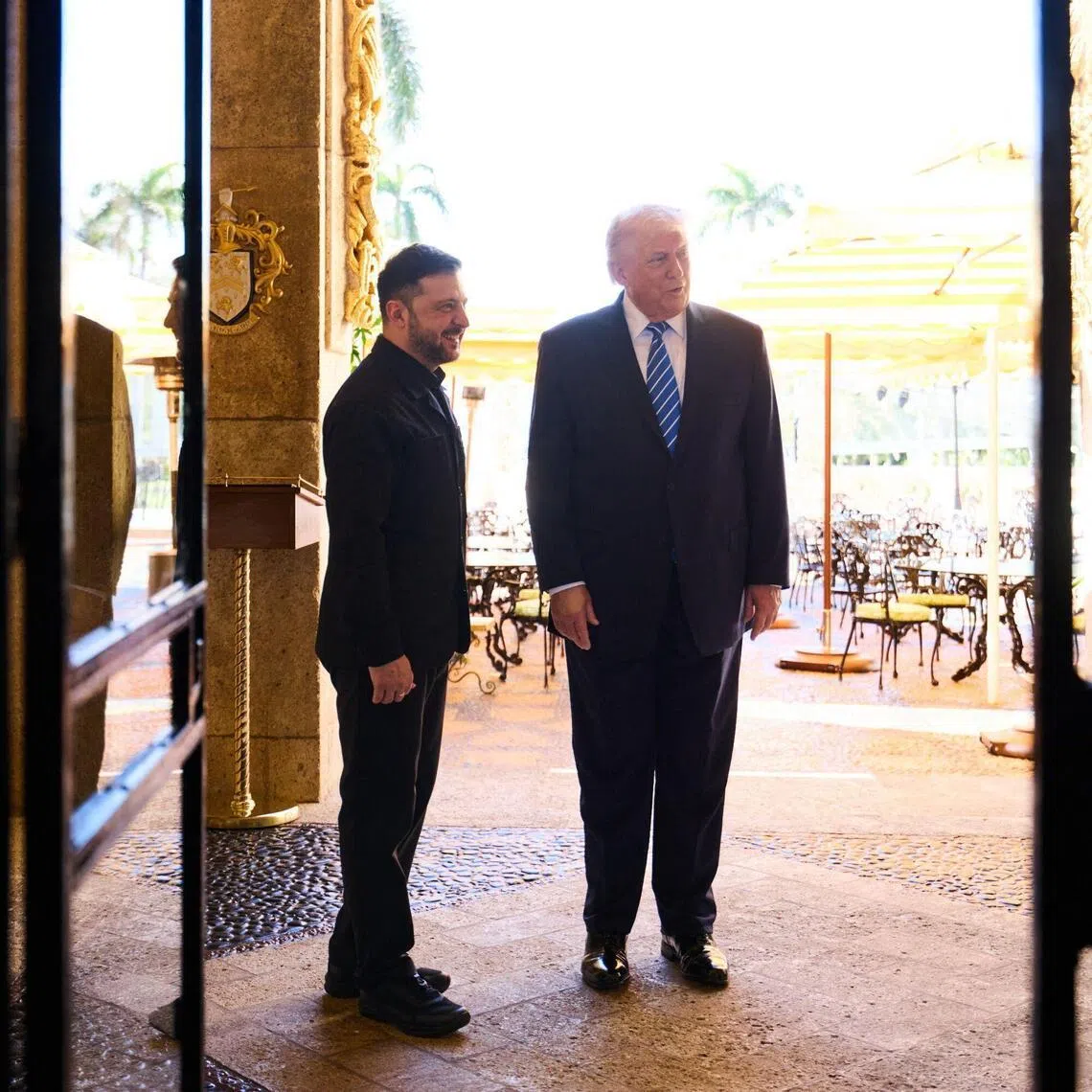 US President Donald Trump (right) welcoming Ukrainian President Volodymyr Zelensky to his Mar-a-Lago estate in Palm Beach, Florida, on Dec 28.