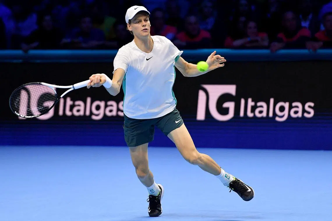 Jannik Sinner of Italy in action against Holger Rune of Denmark at the ATP Finals.