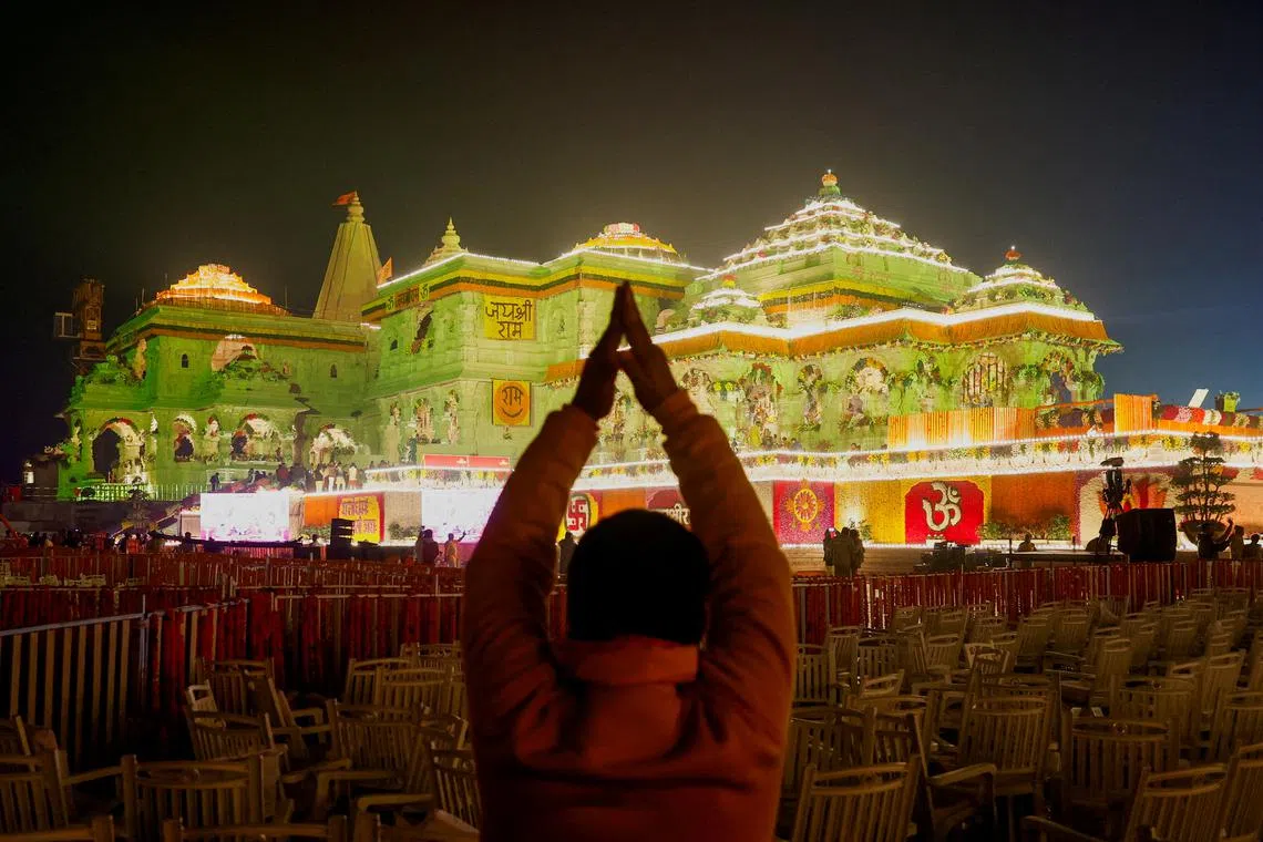 FILE PHOTO: A Hindu devotee prays near the Lord Ram temple after its inauguration, in Ayodhya, India, January 22, 2024. REUTERS/Adnan Abidi/File Photo