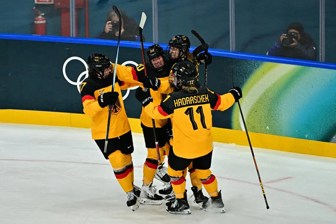 Milano Cortina 2026 Olympics - Ice Hockey - Women's Preliminary Round - Group B - Italy vs Germany - Milano Rho Ice Hockey Arena, Milan, Italy - February 10, 2026. Emily Nix of Germany celebrates scoring their first goal with teammates REUTERS/Marton Monus