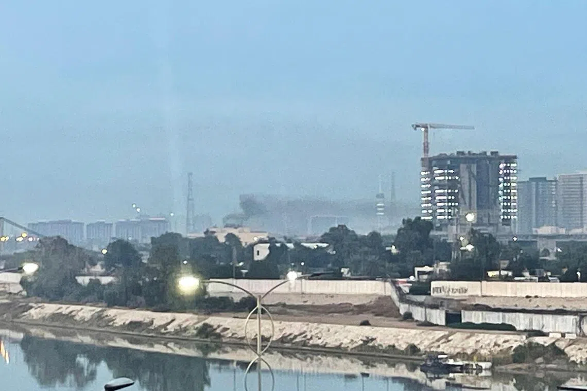 Smoke rises following a drone attack on the US embassy in Baghdad on March 14, 2026.  