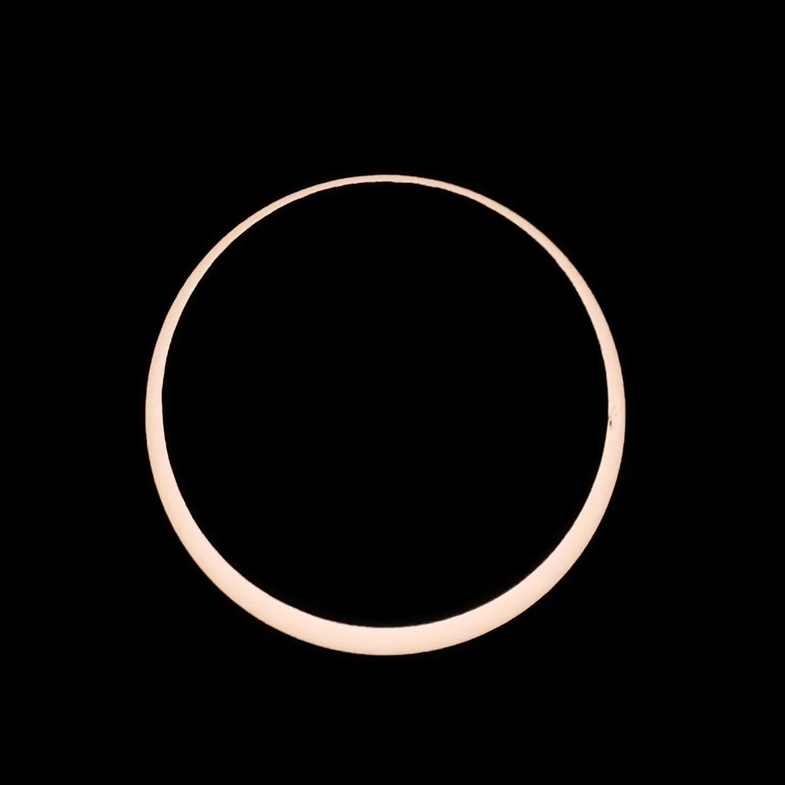 A solar eclipse is observed from Tahai archaeological monument area in the Rapa Nui national park managed by the Mau Henua native community at Easter Island, Chile October 2, 2024. REUTERS/Ivan Alvarado