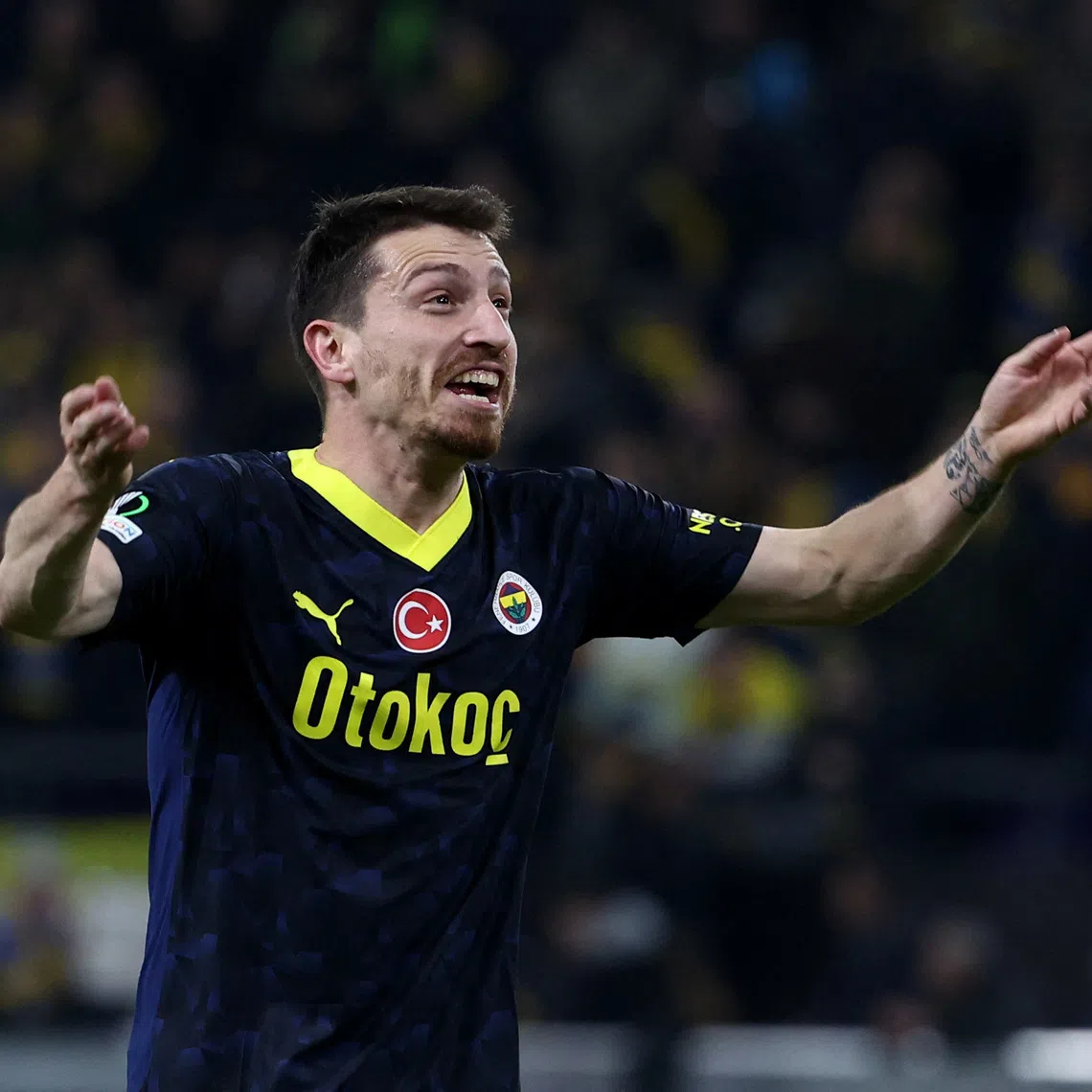 Soccer Football - Europa Conference League - Round of 16 - First Leg - Union Saint-Gilloise v Fenerbahce - Lotto Park, Anderlecht, Belgium - March 7, 2024 Fenerbahce's Mert Hakan Yandas celebrates after Dusan Tadic scores their third goal REUTERS/Yves Herman