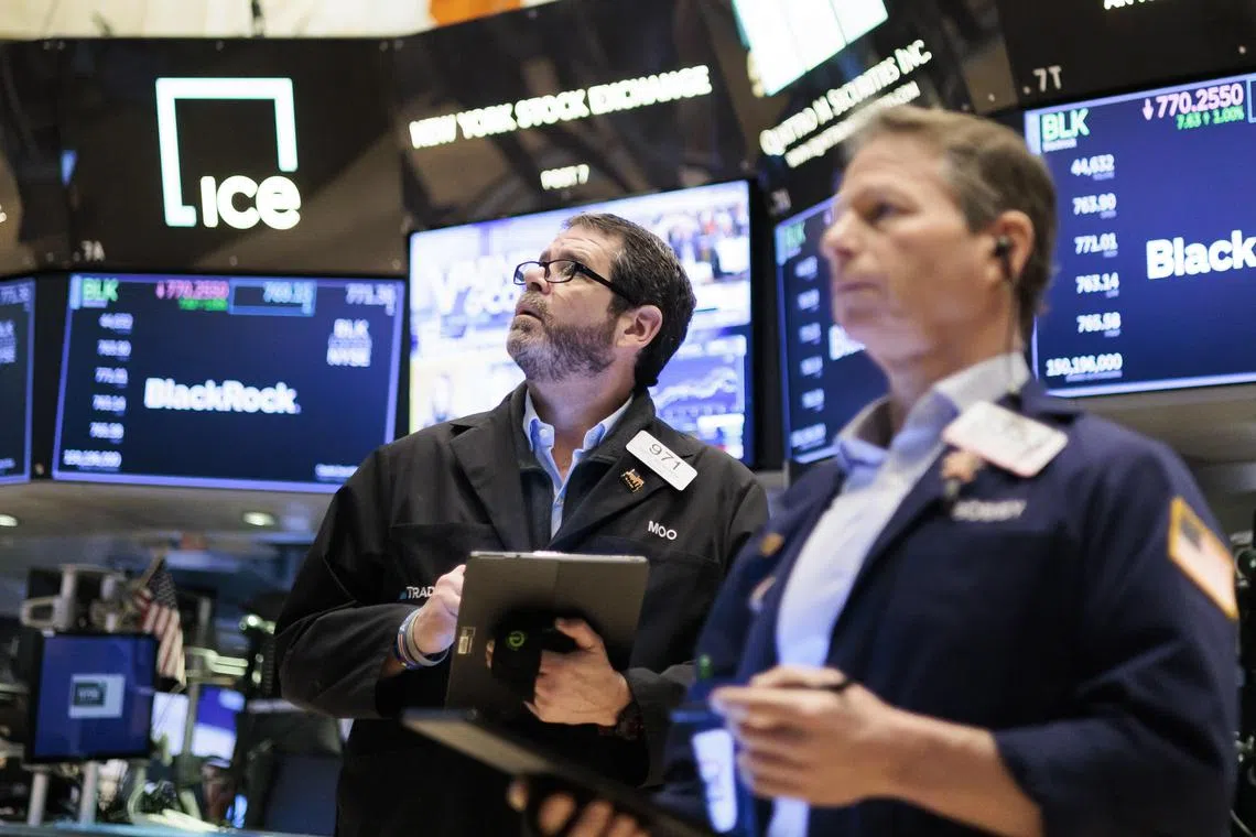 Traders work on the floor of the New York Stock Exchange.
