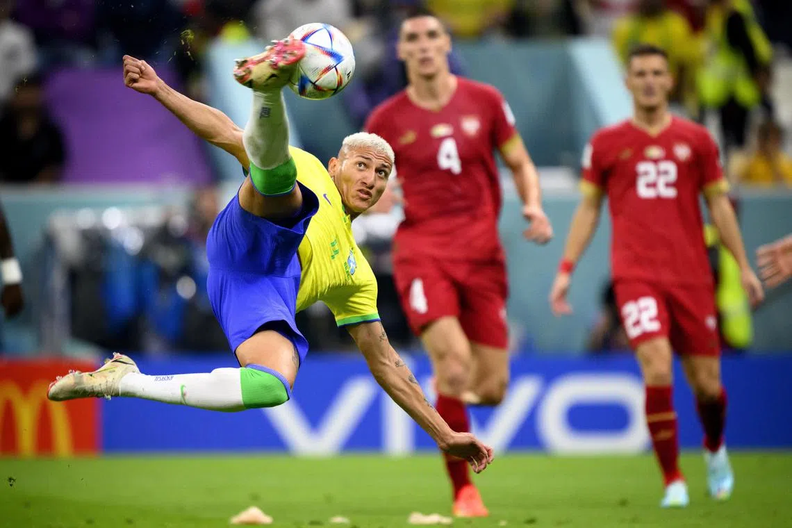 Brazil's Richarlison (left) scores his second goal in front of Serbian defender Nikola Milenkovic (centre) and midfielder Darko Lazovic.