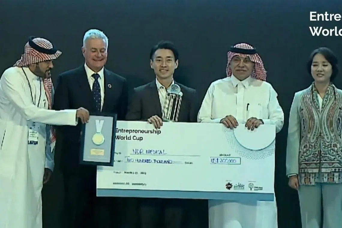 NDR Medical Technology CEO Alan Goh (centre), receiving the second prize and US$200,000 at the Entrepreneurship World Cup in Riyadh on March 12.