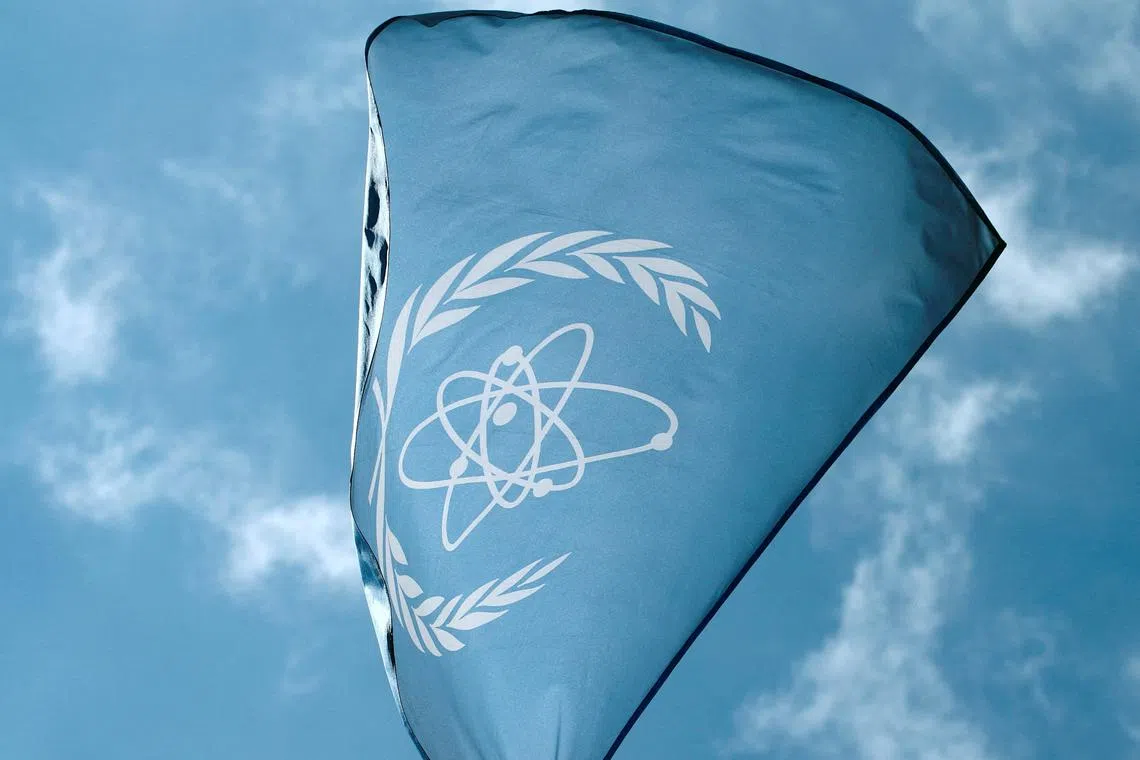 The flag of the International Atomic Energy Agency (IAEA) flies in front of its headquarters in Vienna, Austria, on May 28, 2015.