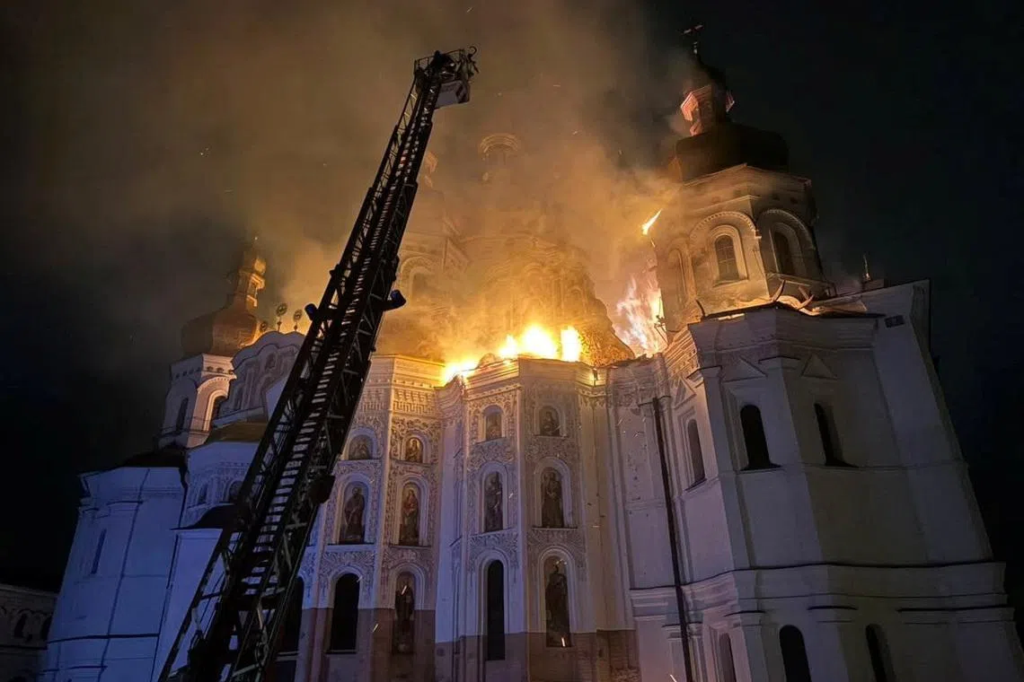 Firefighters work at a site of the Dormition Cathedral of the Kyiv Pechersk Lavra monastery, which burns after it was hit during Russian missile and drone strikes, amid Russia's attack on Ukraine, in Kyiv, Ukraine June 15, 2026. Minister of Culture of Ukraine Tetyana Berezhna via Facebook/Handout via REUTERS