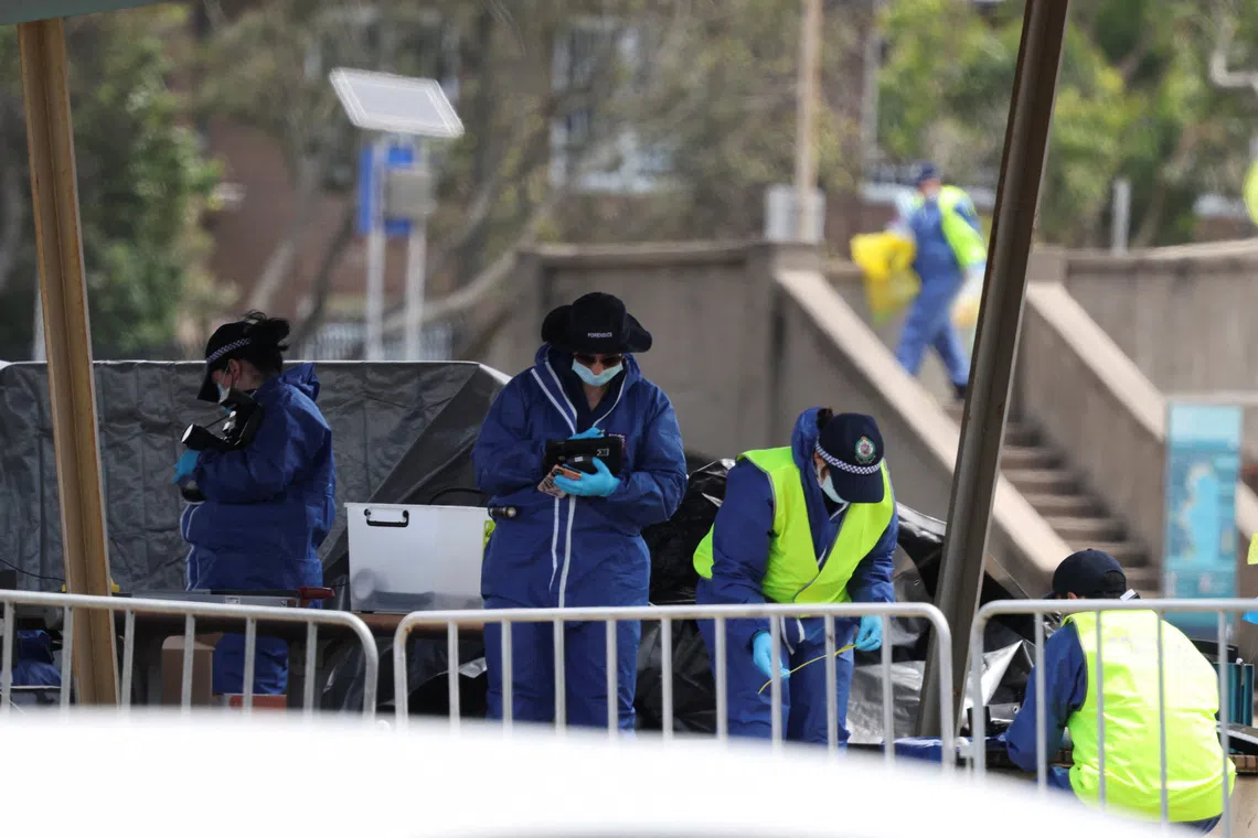 Members of the forensic team work at the scene of a shooting during a Jewish holiday celebration at Bondi Beach, in Sydney, Australia, December 15, 2025. REUTERS/Hollie Adams