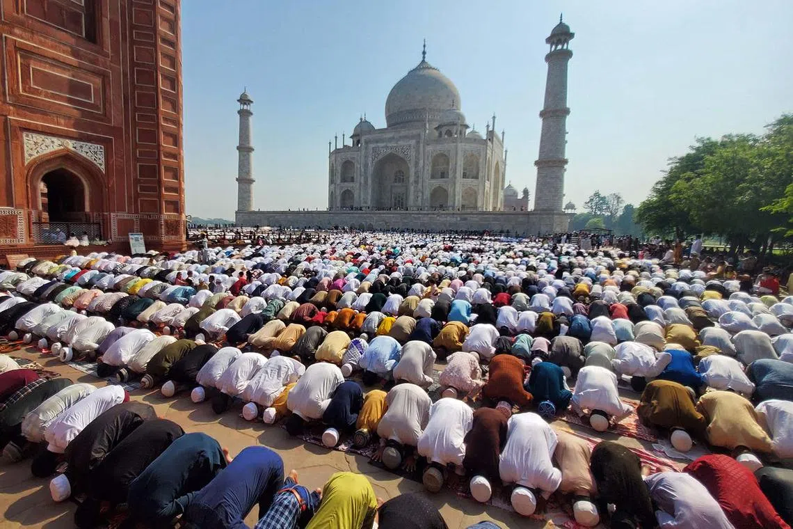 Muslim devotees offer Eid al-Fitr prayers, which marks the end of the holy fasting month of Ramadan, inside the complex of Taj Mahal in Agra, India, on April 11, 2024. 