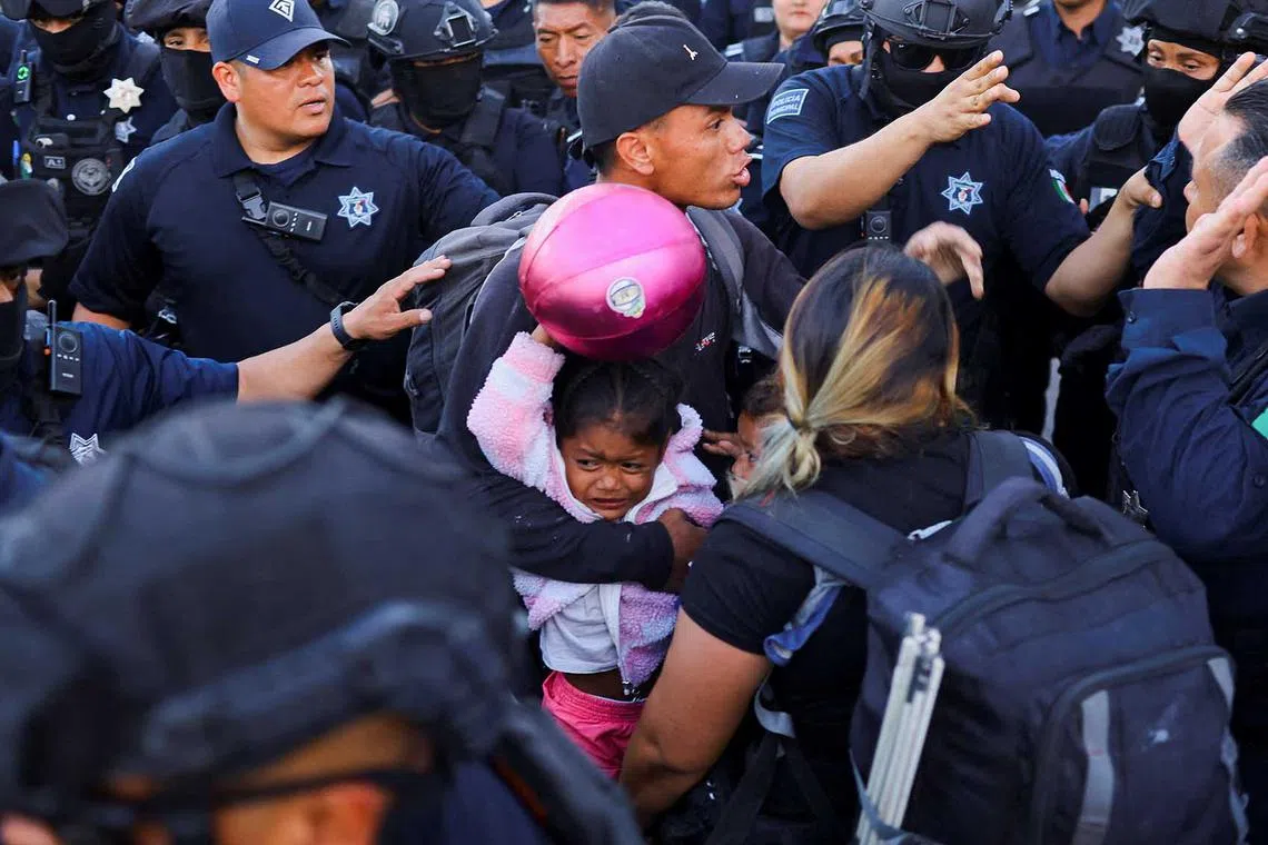 Police evict migrants, mostly from Venezuela, from a camp that was located in front of the migration detention center where migrants died during a fire in March, in Ciudad Juarez, Mexico May 22, 2023. REUTERS/Jose Luis Gonzalez TPX IMAGES OF THE DAY