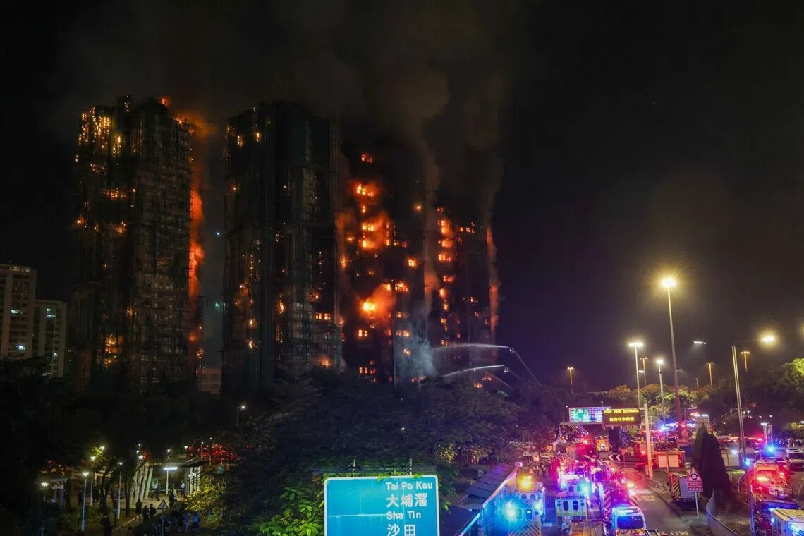 Firefighters tackle a fire engulfing residential buildings at Wang Fuk Court in the Tai Po district of Hong Kong on Nov 26.