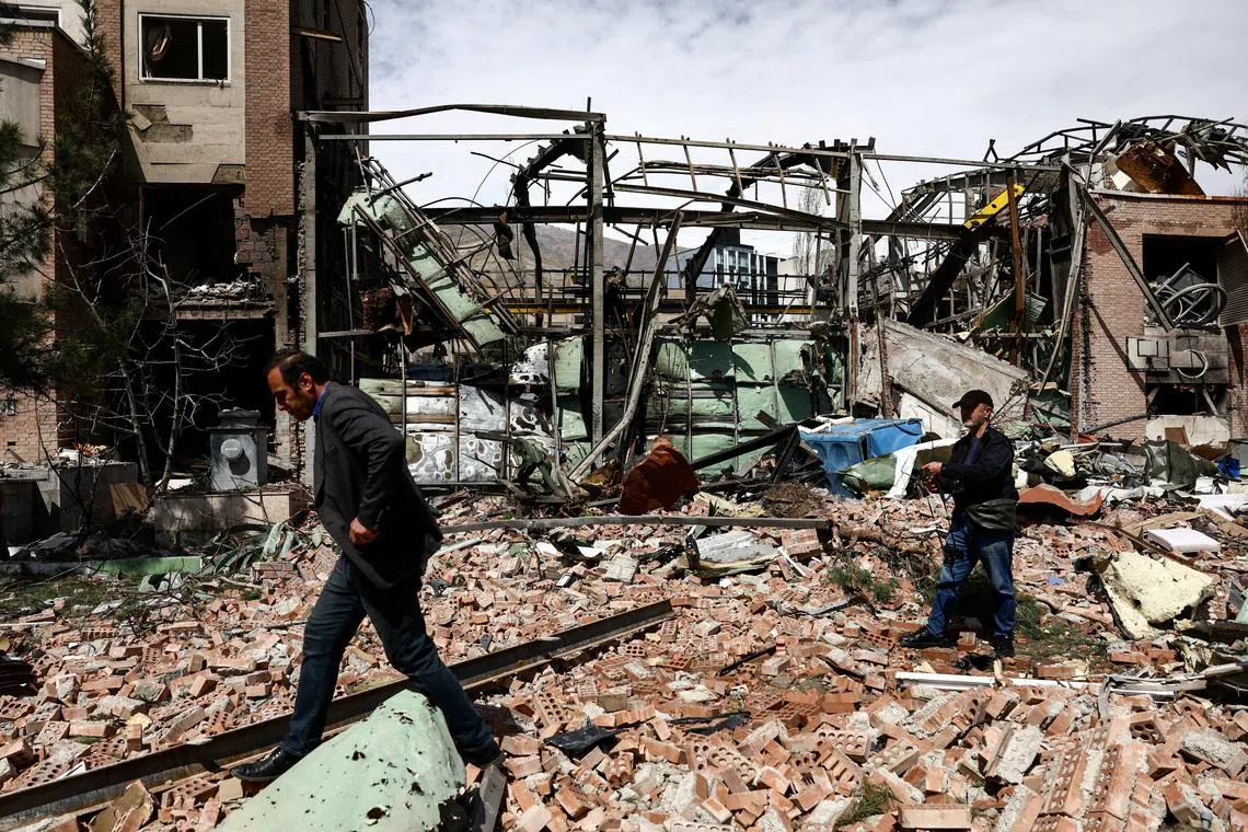 People inspect the damage at the research building of the Shahid Beheshti University, which was damaged by a strike, amid the U.S.-Israeli conflict with Iran, in Tehran, Iran, April 4, 2026.