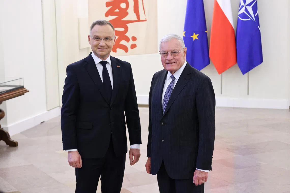 Polish President Andrzej Duda (left) welcoming US special envoy Keith Kellogg to Warsaw, on Feb 18.