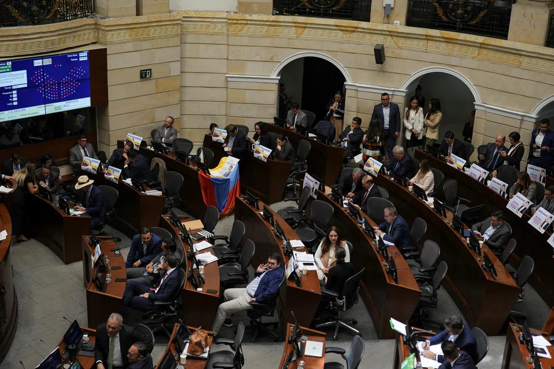 Placards in support of Colombian Senator Miguel Uribe Turbay of the opposition Democratic Center party, who was shot during a campaign event, are displayed at the Congress, on the day of a debate on a labor reform proposed by Colombian President Gustavo Petro's government, in Bogota, Colombia, June 11, 2025. REUTERS/Nathalia Angarita