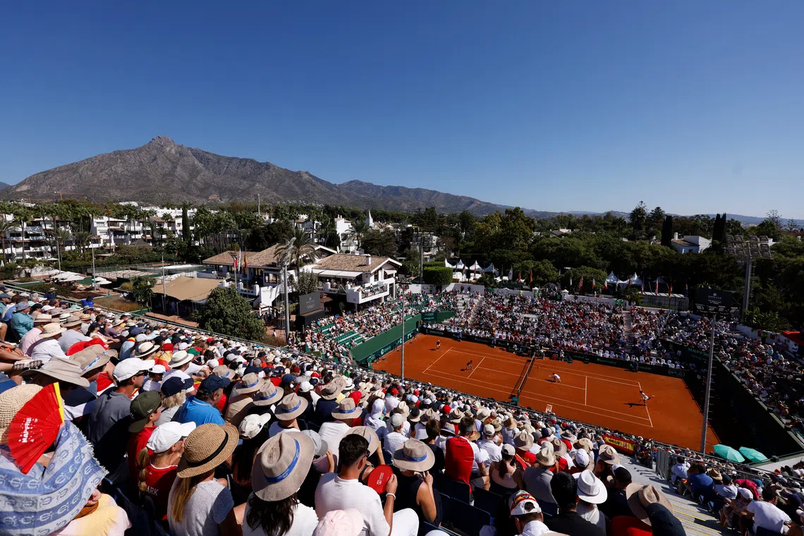 FILE PHOTO: Tennis - Davis Cup - Qualifiers - Second Round - Spain v Denmark - Club de Tenis Puente Romano, Marbella, Spain - September 14, 2025  General view during the doubles match between Denmark's August Holmgren and Denmark's Johannes Ingildsen and Spain's Pedro Martinez and Spain's Jaume Munar REUTERS/Marcelo Del Pozo/ File Photo