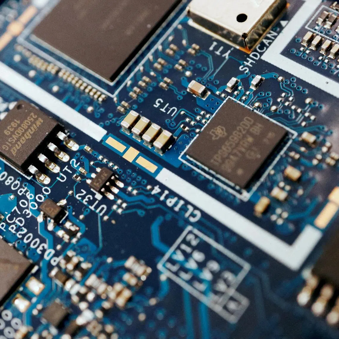 Semiconductor chips are seen on a circuit board of a computer, on Feb 25, 2022.