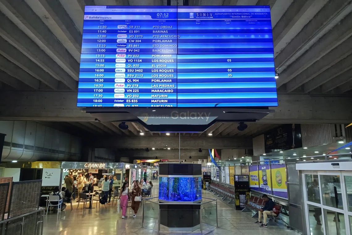 A view of a departures and arrivals screen is seen at the Simon Bolivar International airport in Maiquetia, La Guaira State, Venezuela June 3, 2024. REUTERS/Leonardo Fernandez Viloria