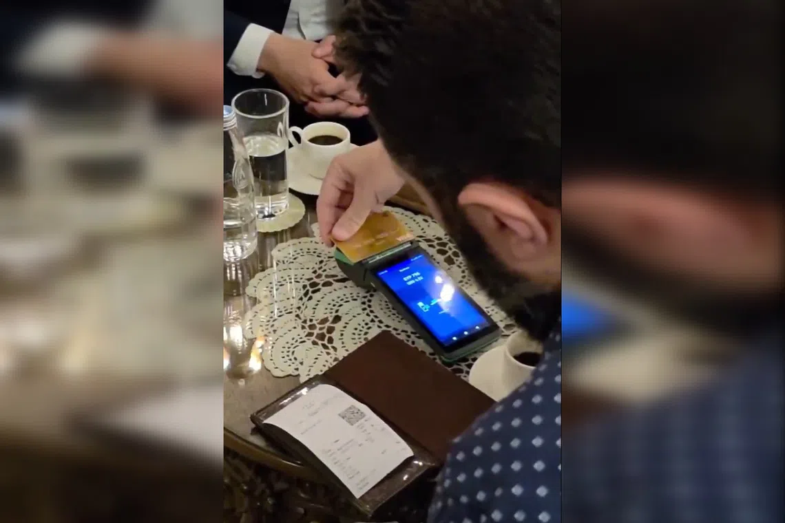 Syrian central bank governor Safwat Raslan posted a video on social media of himself and Syrian President Ahmed al-Sharaa buying coffee at a Damascus cafe by card.