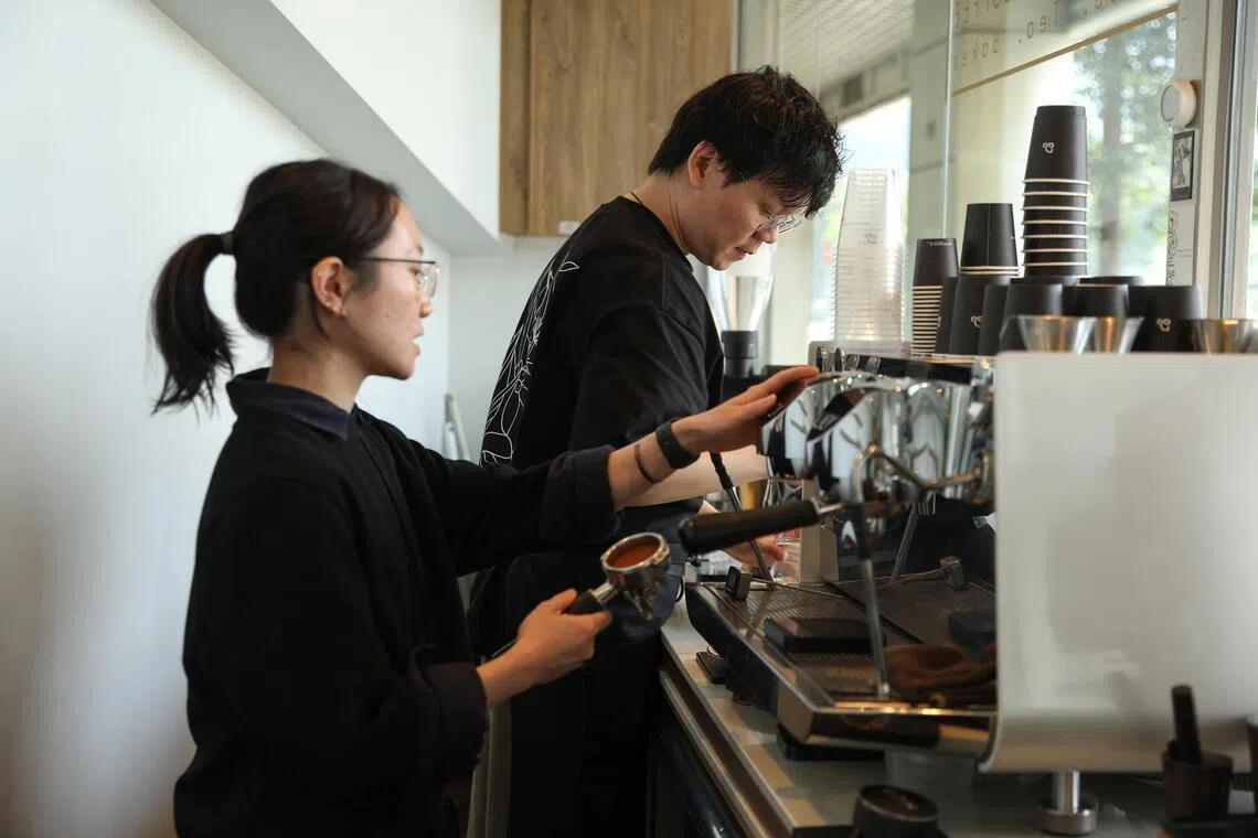 Double Shot Coffee’s manager Lau Ka Man (left) and barista Vincent Tan.