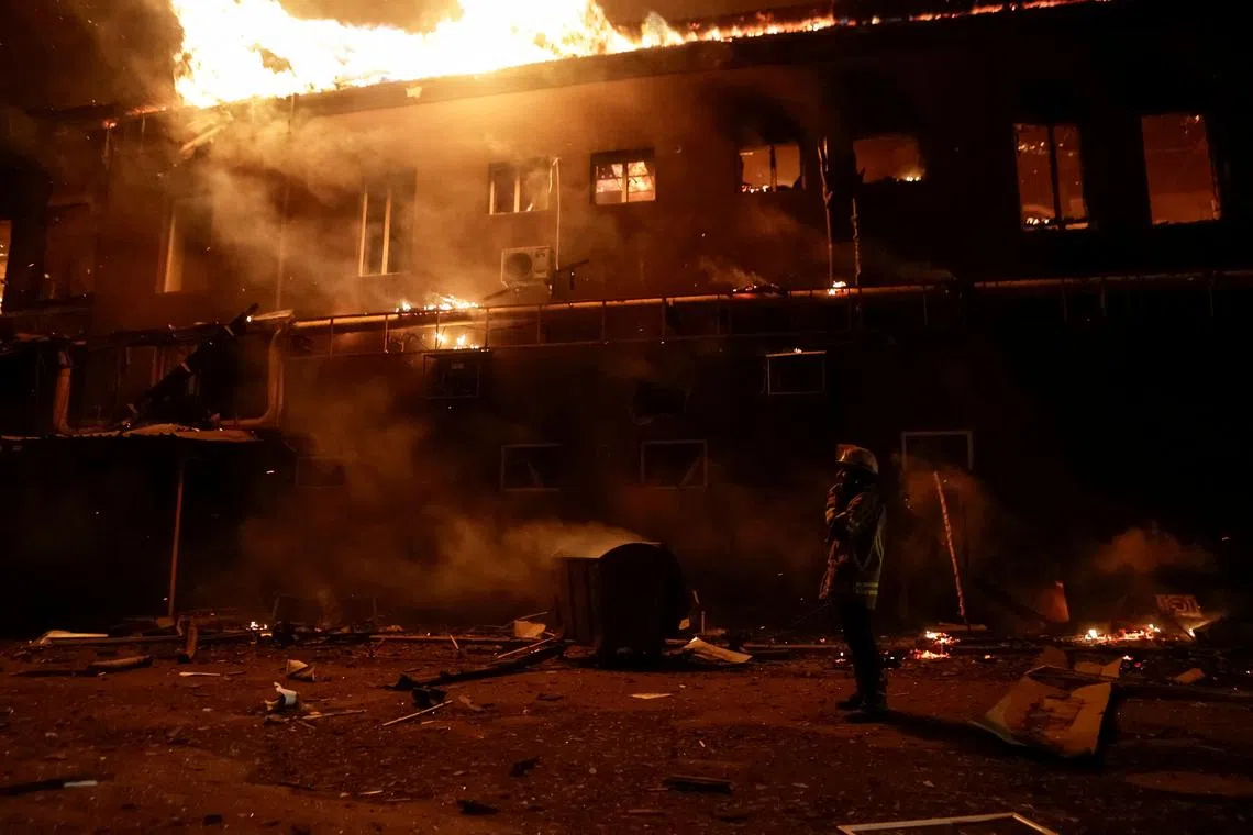 A firefighter works at a site of an apartment building damaged during a Russian drone strike, amid Russia's attack on Ukraine, in Kharkiv, Ukraine January 28, 2025. REUTERS/Sofiia Gatilova