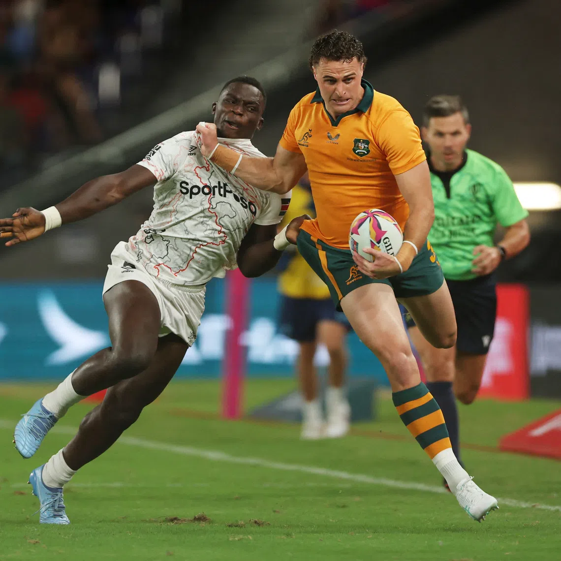 Rugby Union - HSBC Sevens World Championships - Hong Kong - Australia v Kenya - Kai Tak Sports Park, Hong Kong, China - April 17, 2026 Australia's Harry Wilson in action with Kenya's Kevin Wekesa Nyongesa REUTERS/Tyrone Siu